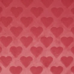 Tissu fausse fourrure structurée motif coeurs - Rose corail