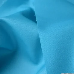 Tissu Gabardine enduite étanche turquoise.