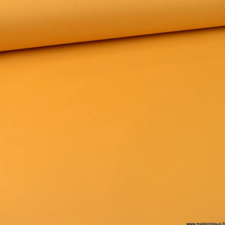 Tissu Gabardine enduite étanche ocre moutarde.