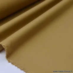 Tissu Gabardine enduite étanche camel.