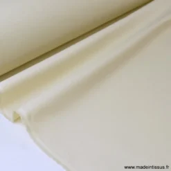 Tissu Gabardine enduite étanche écru.
