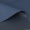 Tissu gabardine polyester viscose enduite étanche bleu denim.