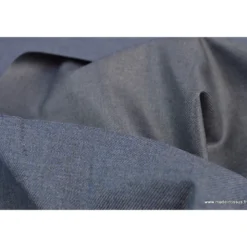 Tissu gabardine polyester viscose enduite étanche jean.