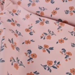 Tissu imperméable Alina type ciré de pluie motif fleurs fond Nude