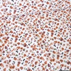 Tissu imperméable Ebbie type ciré motif léopard fond écru