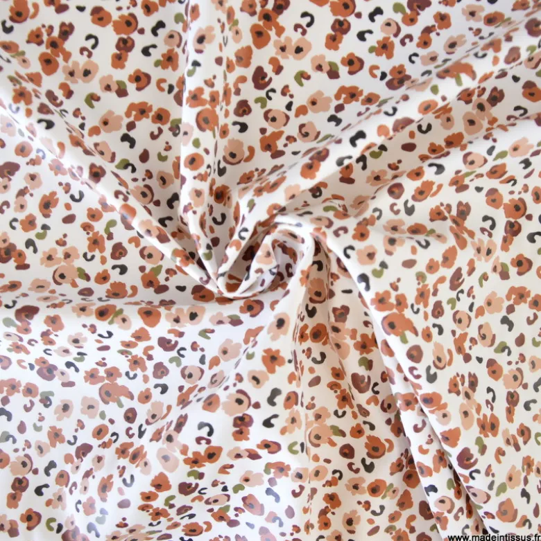 Tissu imperméable Ebbie type ciré motif léopard fond écru