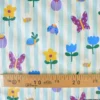 Tissu imperméable Hypolite type ciré de pluie motif fleurs et rayures