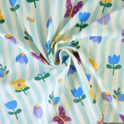 Tissu imperméable Hypolite type ciré de pluie motif fleurs et rayures