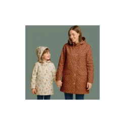 Tissu imperméable Ilapio type ciré motif lapins fond écru