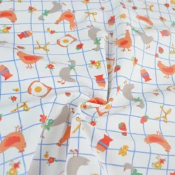 Tissu imperméable Kokott type ciré de pluie motif poules