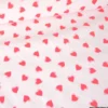 Tissu imperméable Popheart type ciré de pluie motif coeurs fond rose pale