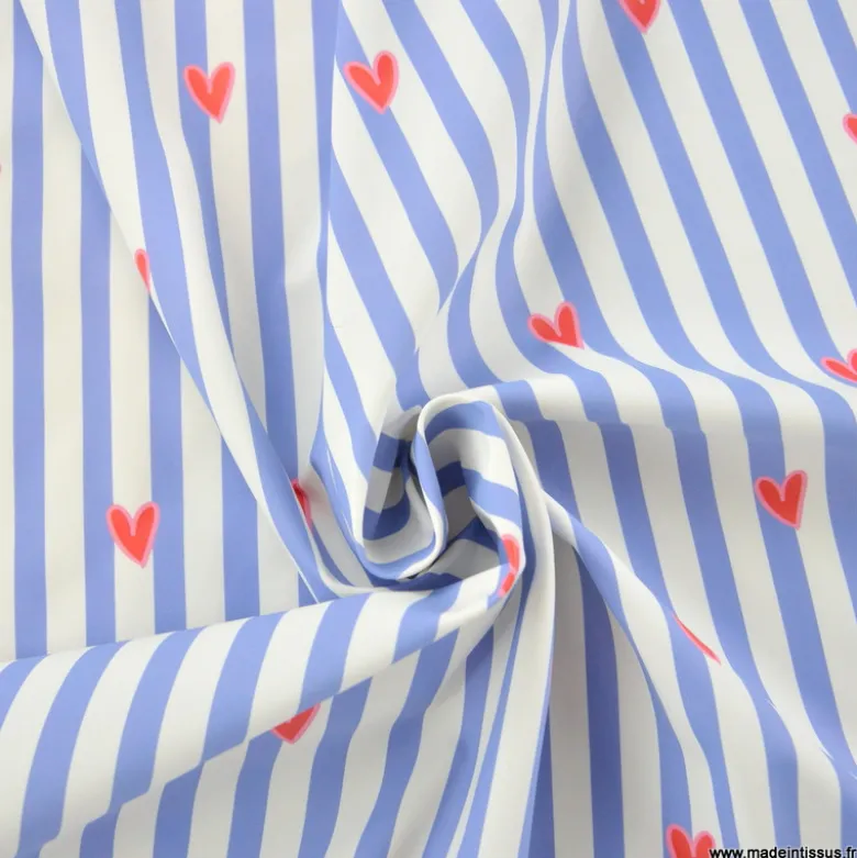 Tissu imperméable Suzette type ciré de pluie motif coeurs et rayures bleues