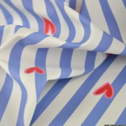 Tissu imperméable Suzette type ciré de pluie motif coeurs et rayures bleues