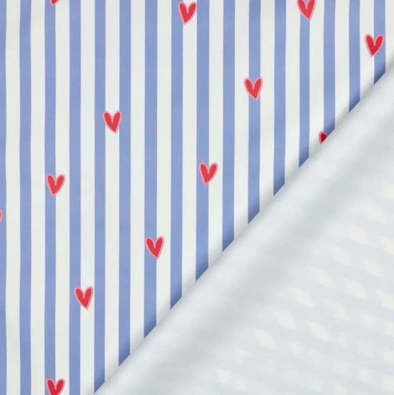 Tissu imperméable Suzette type ciré de pluie motif coeurs et rayures bleues