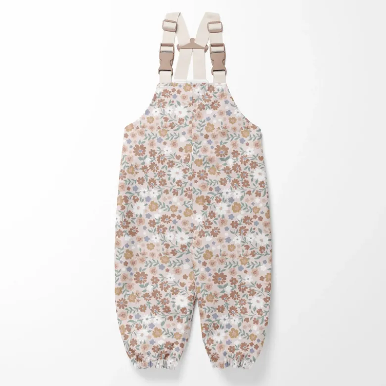 Tissu imperméable type ciré motif fleurs fond rose clair