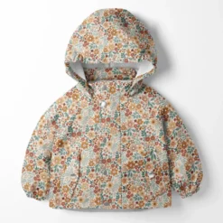 Tissu imperméable type ciré motif fleurs fond blanc cassé