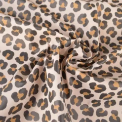 Tissu imperméable type ciré motif léopard fond écru