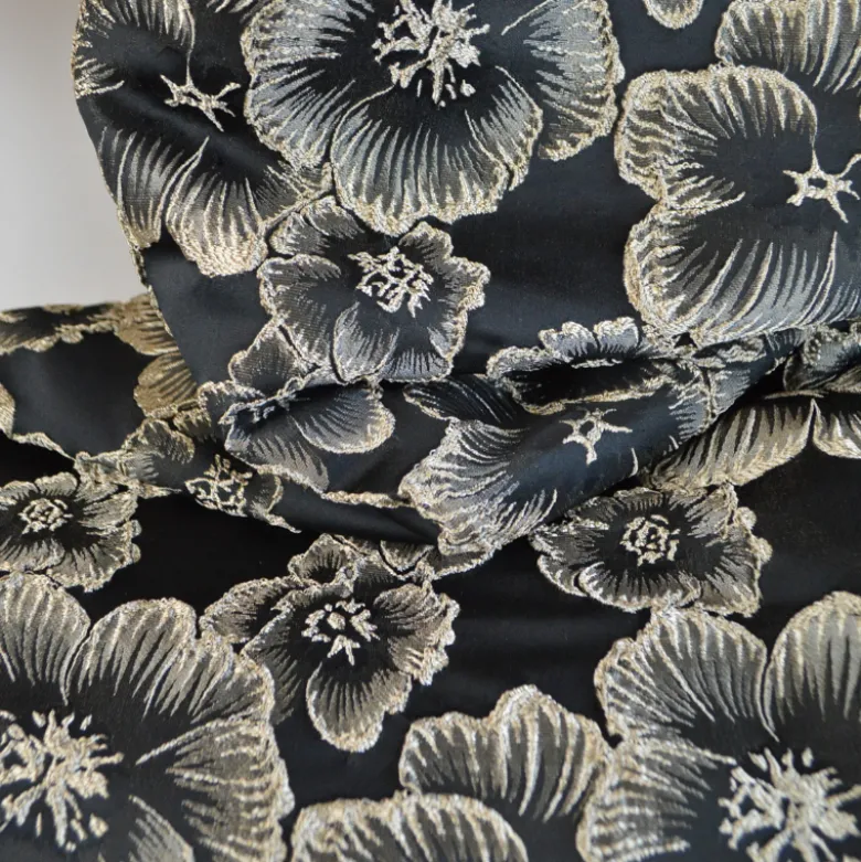 Tissu jacquard Habillement fleuri noir irisé