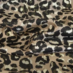 Tissu jacquard Habillement Leopard noir et doré fond beige