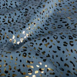 Tissu Jean fin motif Léopard doré fond bleu