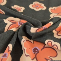 Tissu jersey coton Poppy motif fleurs orange sur fond noir