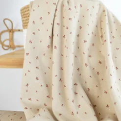 Tissu jersey côtelé fines côtes – Motif fleurs terracotte fond beige