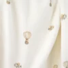 Tissu jersey côtelé fines côtes – Motif fleurs montgolfières fond blanc cassé