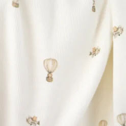 Tissu jersey côtelé fines côtes – Motif fleurs montgolfières fond blanc cassé