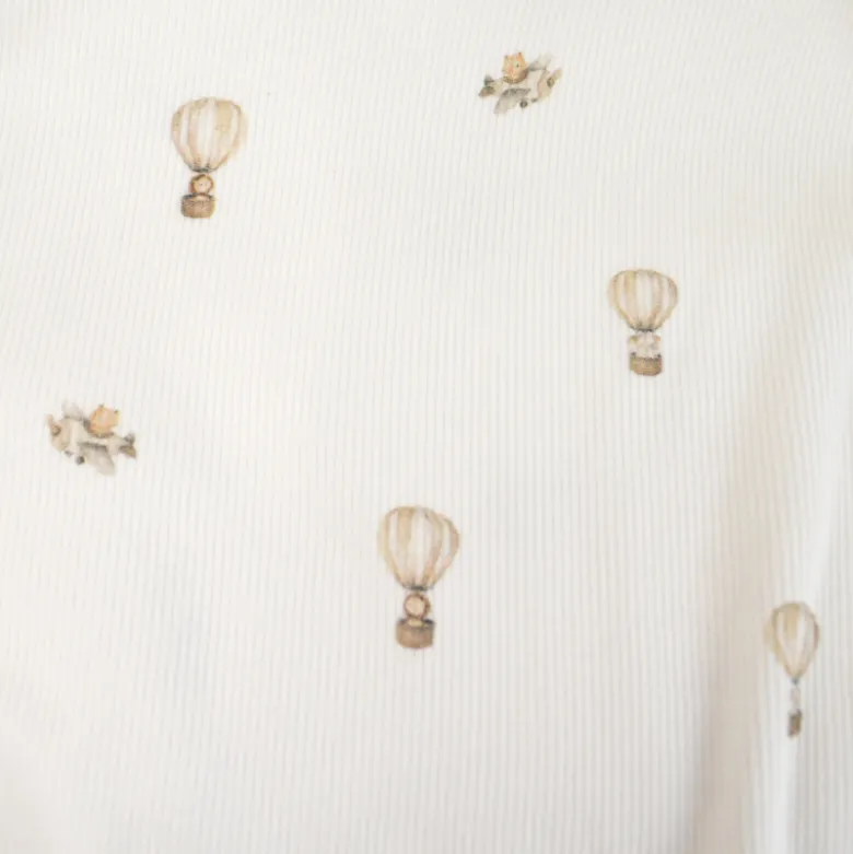 Tissu jersey côtelé fines côtes – Motif fleurs montgolfières fond blanc cassé