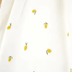 Tissu jersey côtelé fines côtes – Motif citrons fond blanc cassé