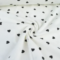 Tissu jersey côtelé motif coeurs Noirs fond blanc