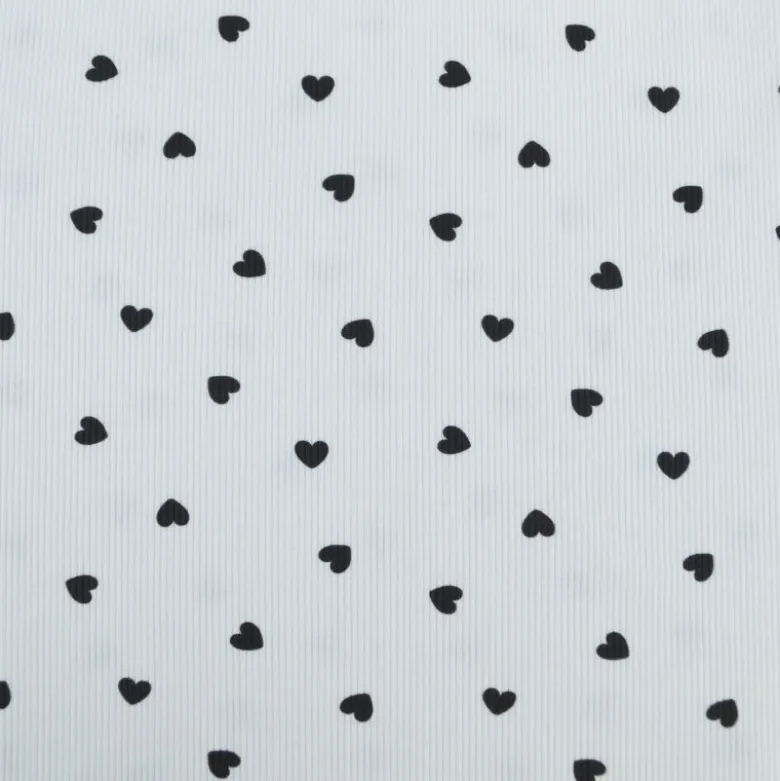 Tissu jersey côtelé motif coeurs Noirs fond blanc