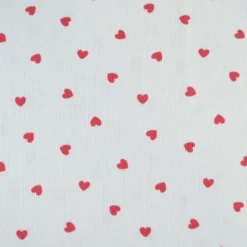 Tissu jersey côtelé motif coeurs rouges fond blanc