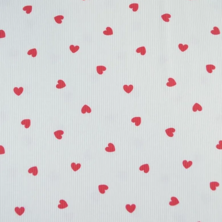 Tissu jersey côtelé motif coeurs rouges fond blanc