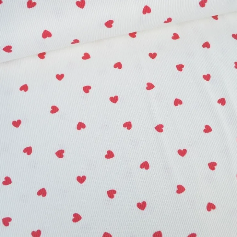 Tissu jersey côtelé motif coeurs rouges fond blanc