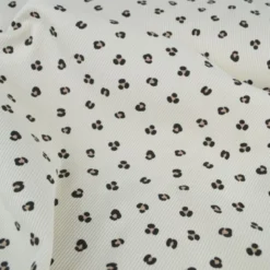 Tissu jersey côtelé motif léopard fond sable