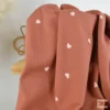 Tissu jersey côtelé motif petits coeurs fond vieux rose - OEKO TEX