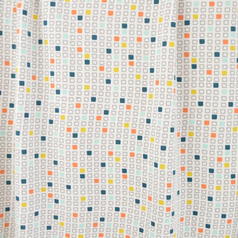 Tissu jersey cubes géométriques – Bleu, orange et jaune sur fond blanc