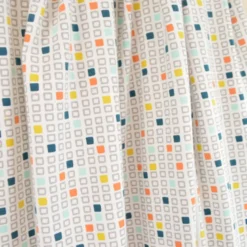 Tissu jersey cubes géométriques – Bleu, orange et jaune sur fond blanc