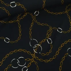Tissu Jersey milano motif chaines dorés fond noir