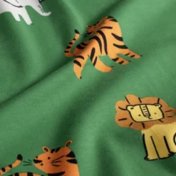 Tissu Jersey motif éléphants, tigres et lions fond vert - OEKO TEX