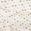 Tissu jersey motif petits coeurs dorés, roses et camel - OEKO TEX