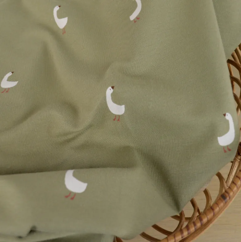 Tissu jersey motifs oies sur fond vert kaki - OEKO TEX