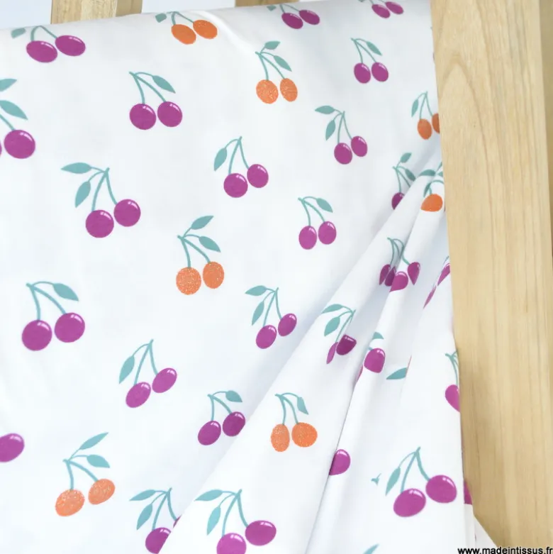 Tissu jersey Poppy motif cerises à paillettes fond blanc - OEKO TEX