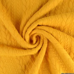 Tissu jersey torsadé jaune moutarde