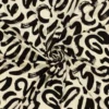 Tissu jersey viscose motif abstrait beige et noir