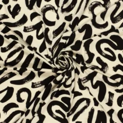 Tissu jersey viscose motif abstrait beige et noir