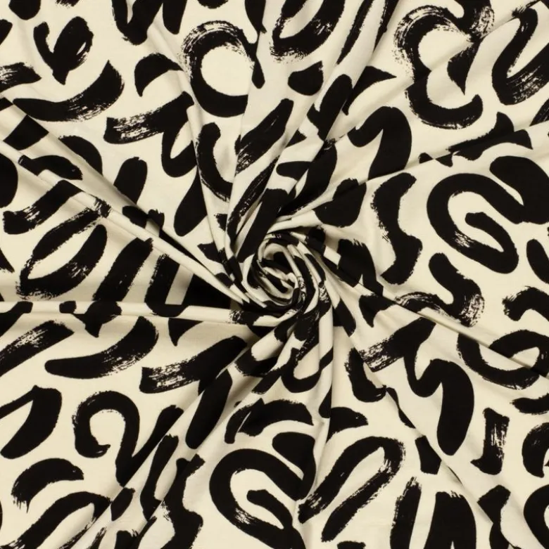 Tissu jersey viscose motif abstrait beige et noir