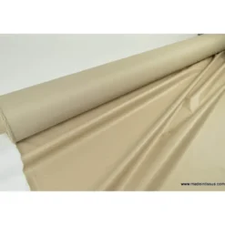 Tissu leger imperméable étanche polyester enduit acrylique beige .