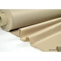 Tissu leger imperméable étanche polyester enduit acrylique beige .